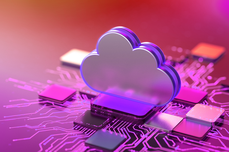 A metallic, 3D cloud icon sitting prominently on top of a purple and pink illuminated electronic circuit board with microchips, representing secure cloud computing infrastructure.