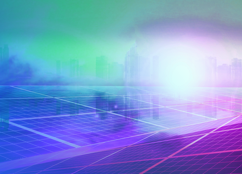 Solar panel field with a city skyline in the background illuminated by colorful light